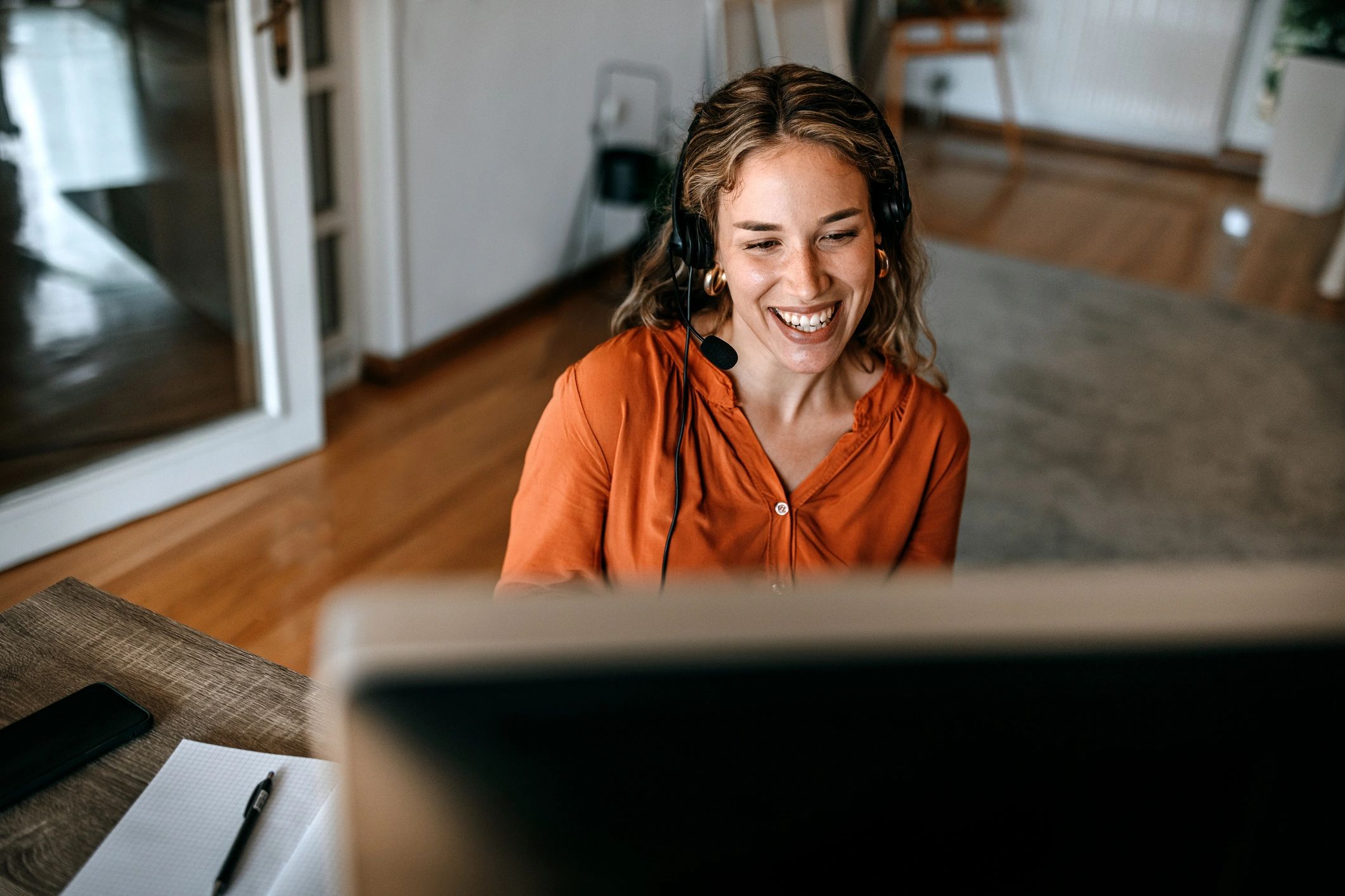 Advisor on a video call wearing headphones